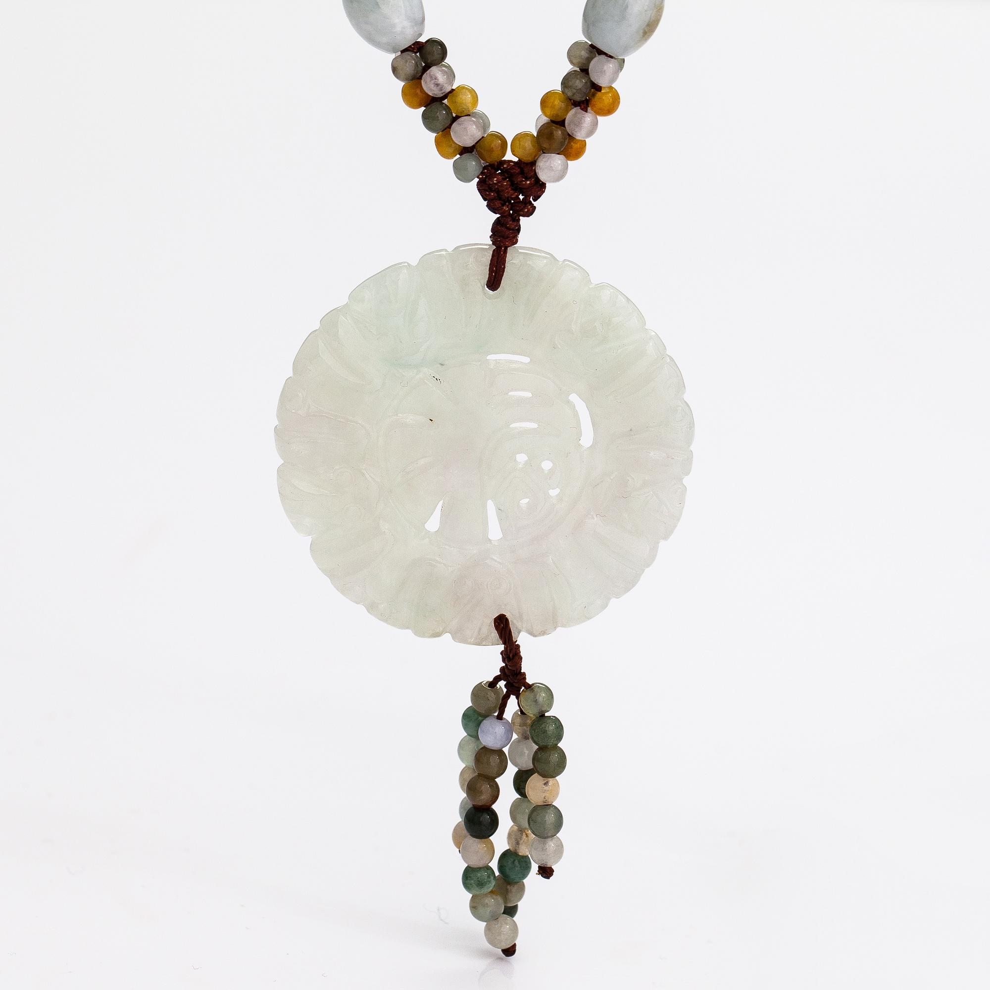 A collier with jade and nyon cord.