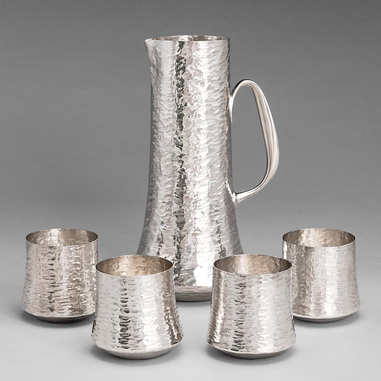 TAPIO WIRKKALA, A silver pitcher with four silver beakers, marked TW, Kultakeskus oy, Hämeenlinna Finland 1973 and 1977.