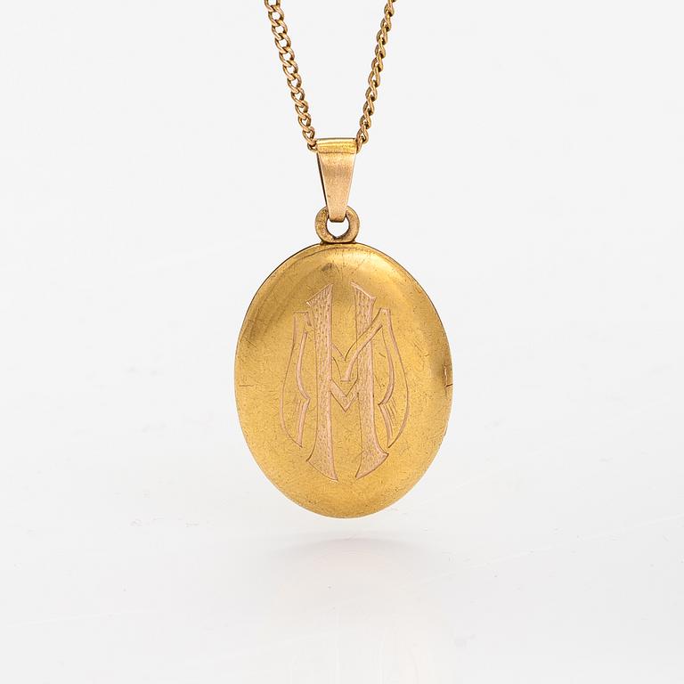 A 14K gold necklace with a medallion.