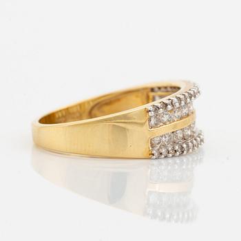 18K gold and small brilliant cut diamond ring.