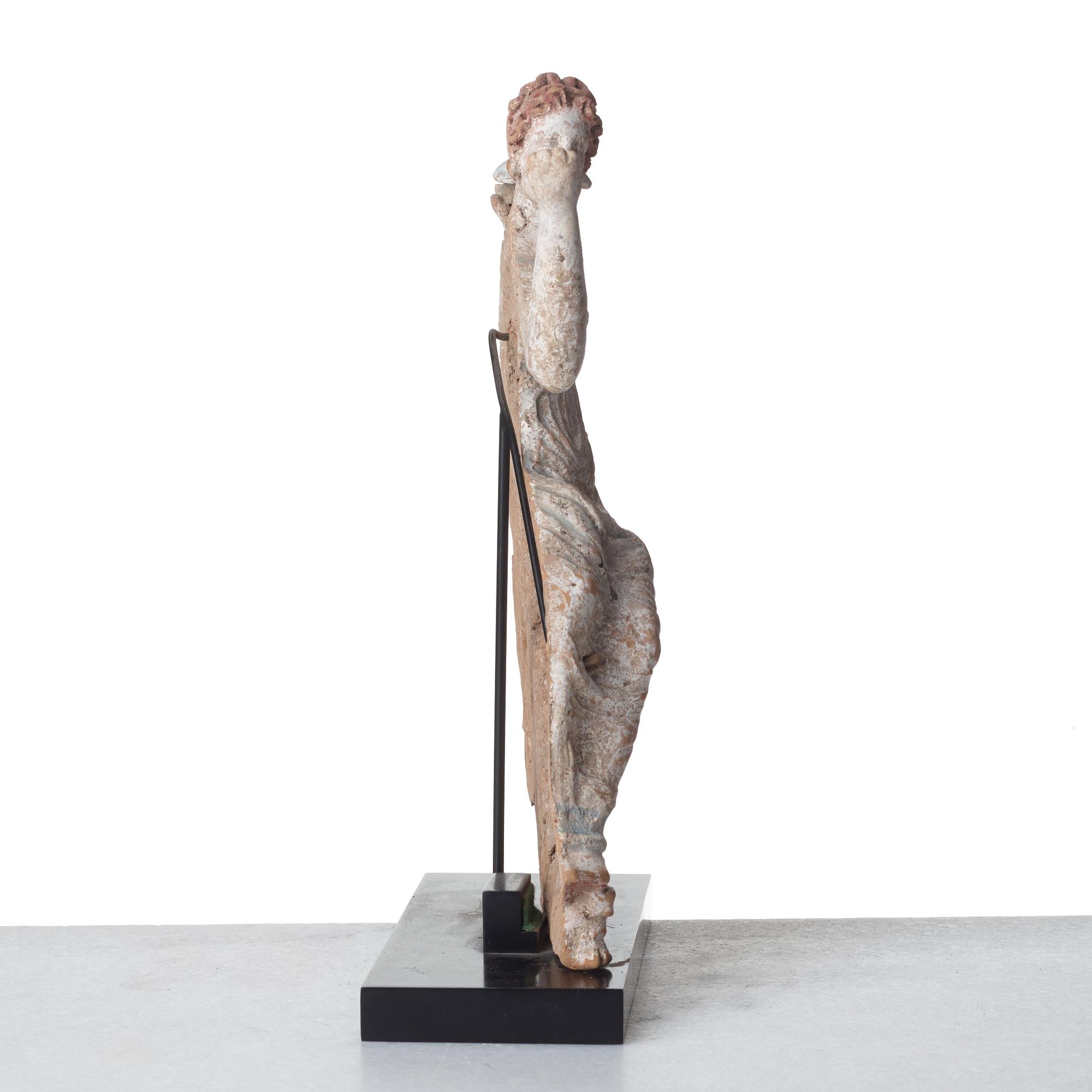 A Greek pottery sculpture of a seated lady, Hellenistic, probably circa 2nd Century B.C.