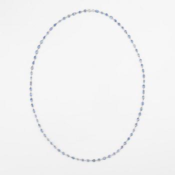 An 18K white gold necklace set  with faceted sapphires.