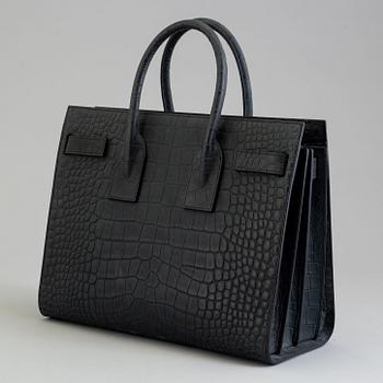 A bag by Yves Saint Laurent, "Sac du jour".