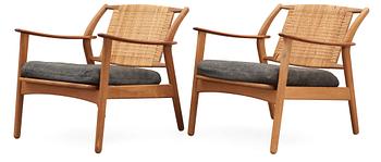 486. A pair of Danish teak and ratten armchairs, attributed, 1950's-60's.
