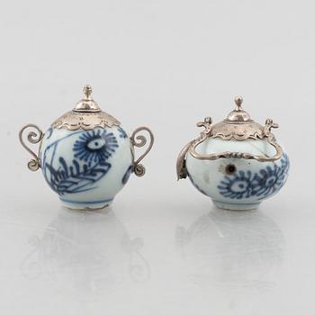 A group of six Chinese blue and white porcelain miniatures and a caddy with cover, Qing dynasty, partly Kangxi.