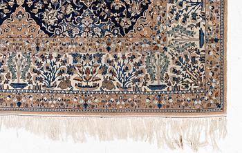 A semi-antique Nain carpet, part-silk, c. 261 x 175 cm.
