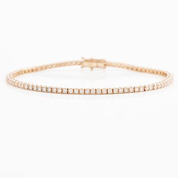 Tennis bracelet in 18K rose gold with brilliant-cut diamonds.