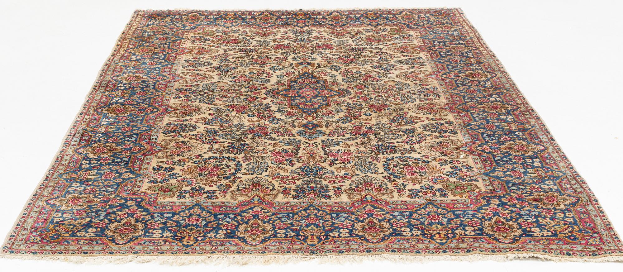 A carpet, Kerman, ca 323 x 213 cm.