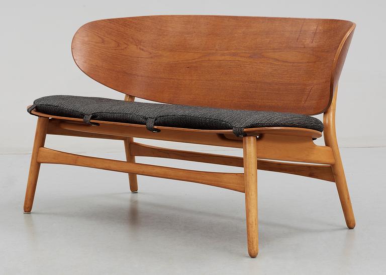 A Hans J Wegner teak and beech 'Shell' settee by Fritz Hansen, Denmark, 1950's.