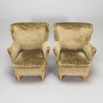 A pair of 1950s armchairs.