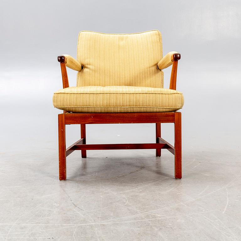 A Josef Frank walnut armchair Firma Svenskt Tenn model nr 667.
