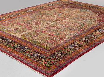 A CARPET, semi-antique Kerman, ca 360 x 284 cm.