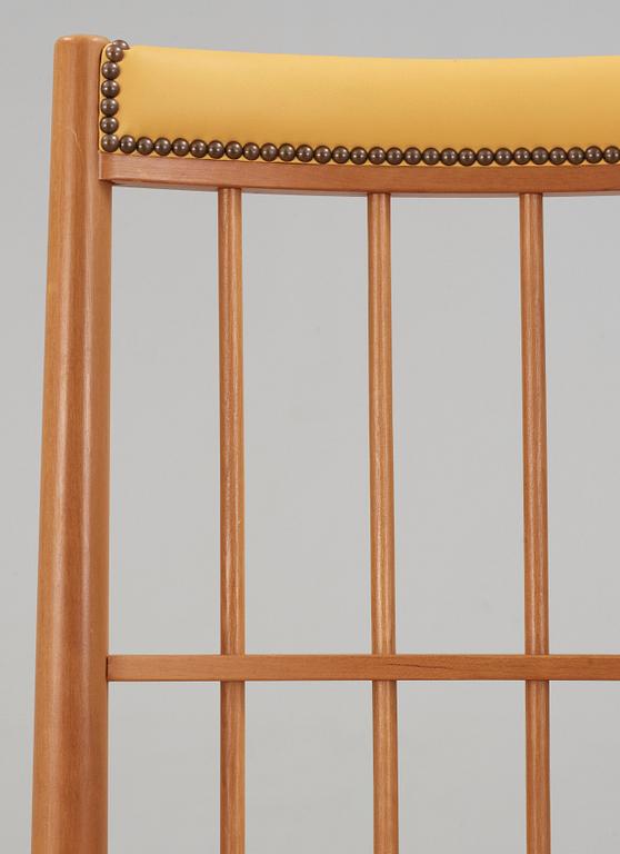A Josef Frank cherry and yellow leather armchair, Svenskt Tenn, model 652.
