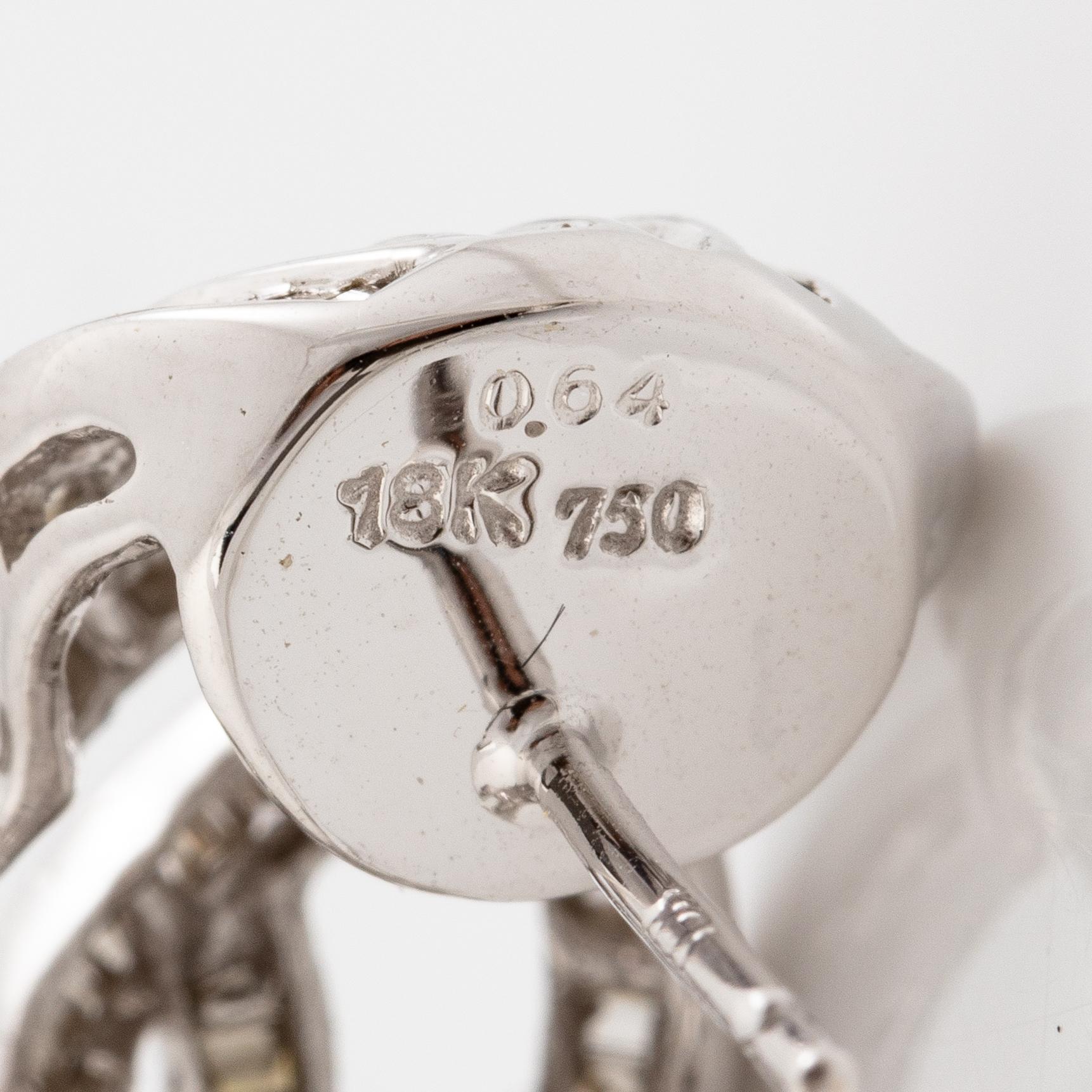 Earrings, a pair, 18K white gold with baguette-cut diamonds.