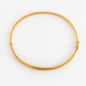 Armring, 18K guld med briljantslipade diamanter och rubiner.