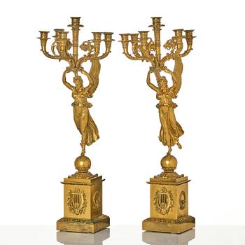 A pair of six-branch gilt bronze Empire candelabra, Paris, early 19th century.