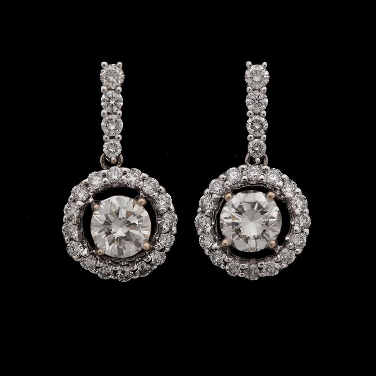 A pair of brilliant cut diamond earrings, tot. 1.34 ct.