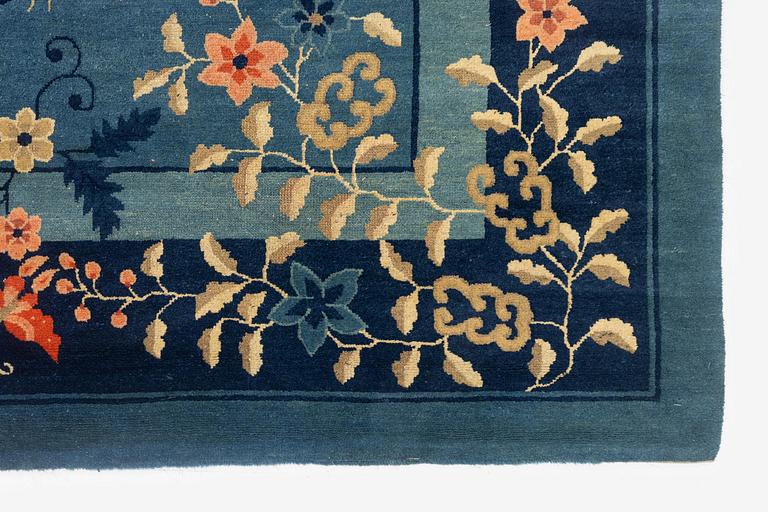 An antique Beijing carpet, northern China, c. 365 x 294 cm.