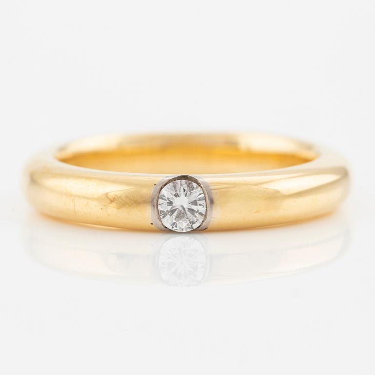 Ring in 18K gold with a round brilliant-cut diamond.