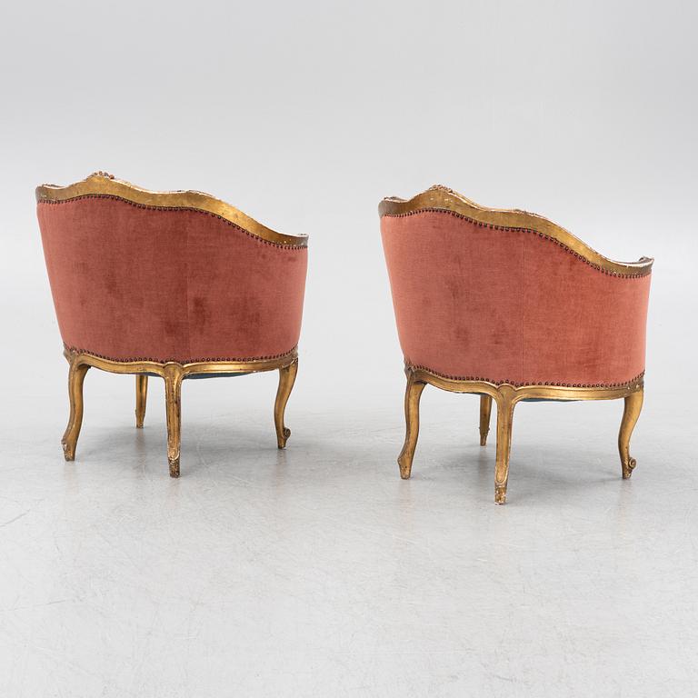 A pair of rococo style armchairs, around 1900.