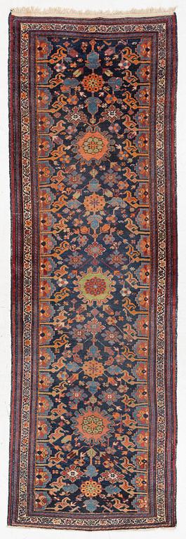 A north-west Persian, semi-antique runner, c. 340 x 110 cm.