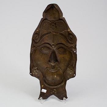 A copper alloy mask of a deity, south east asia, presumably 19th Century.