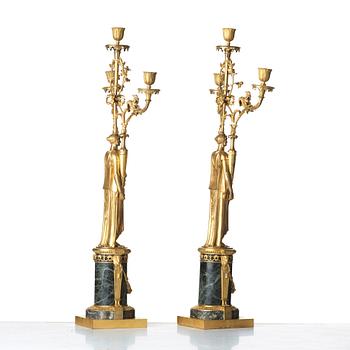 A pair of French Directoire three-light candelabra, circa 1800.