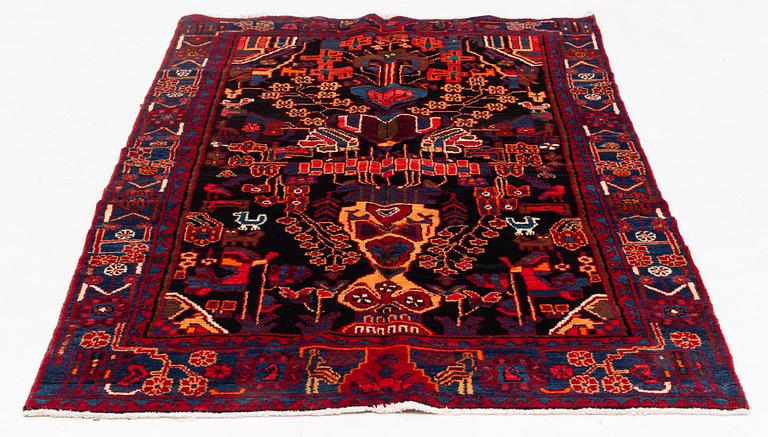 An oriental rug, ca 233 x 128 cm.