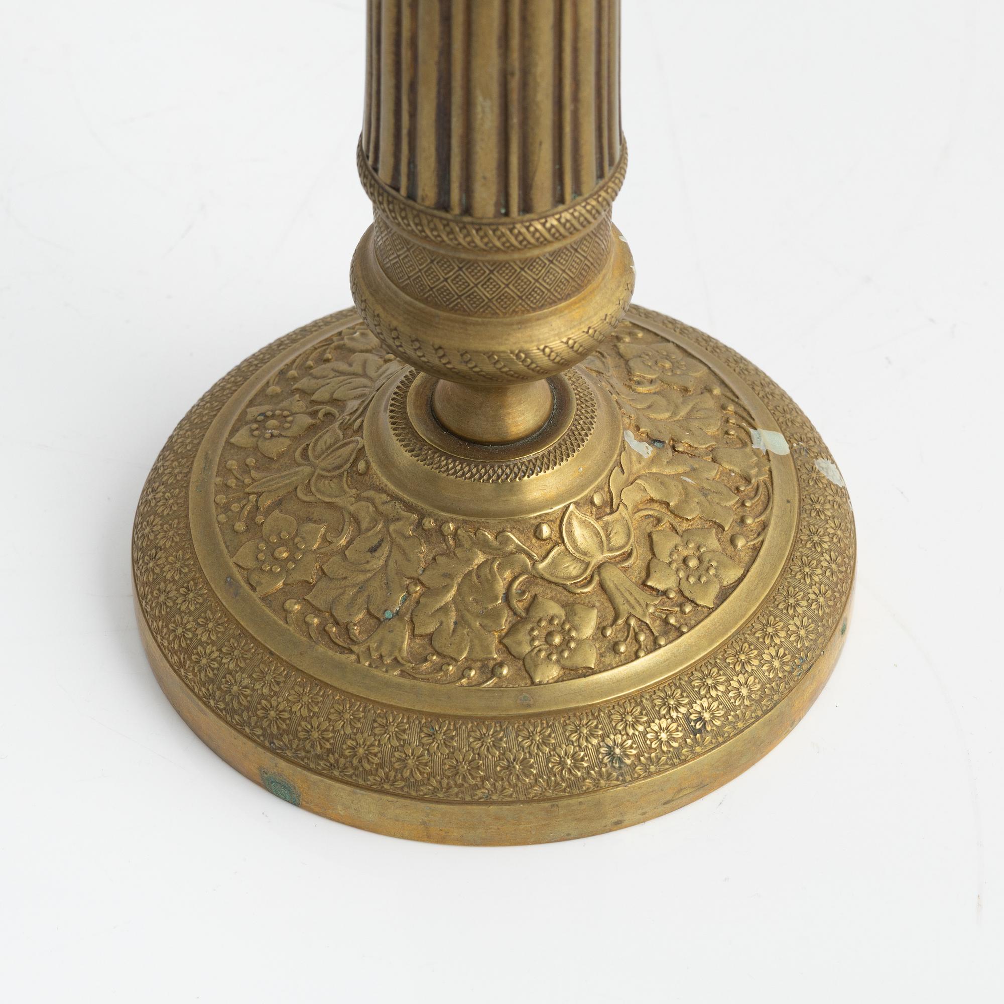 A brass Empire candlestick, first half of the 19th century,