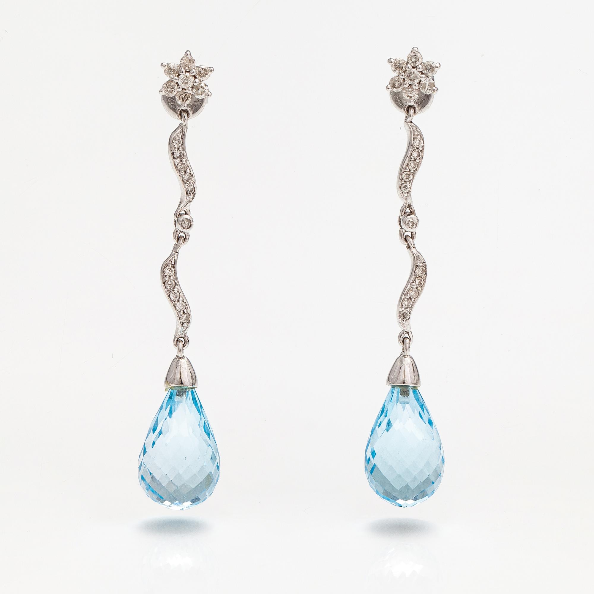 A pair of 18K white gold earrings with topazes and diamonds ca. 0.37 ct in total.