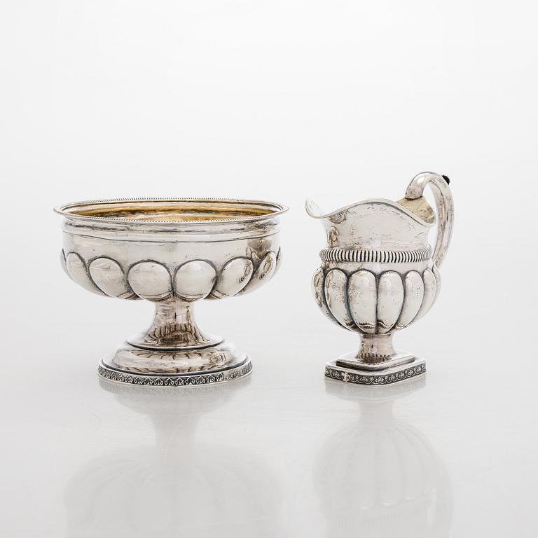 A silver cream jug by A.G. Illberg, Hamina, and a silver bonbonnière by Hj. Fagerroos, Helsingfors, 19th century.