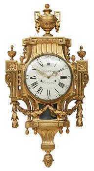 973. A Gustavian wall clock by N. Berg.