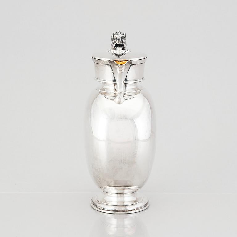 An English silver jug with lid, makers mark Hunt & Roskell Late Storr & Mortimer, London 1881.