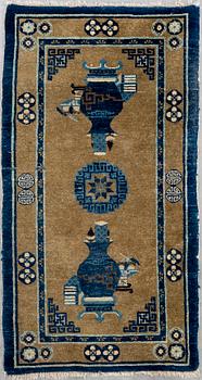 A Baotou carpet seminatique ca 126 x 65 cm.