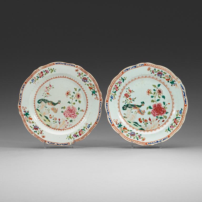 A pair of famille rose 'double peacook' dinner plates. Qing dynasty, Qianlong (1736-95).