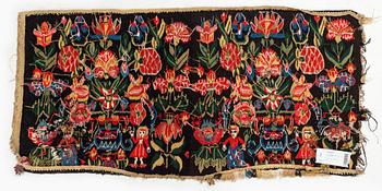 A carrige cushion, 'Urnor och par', tapestry weave, c. 102 x 51 cm, around the years 1800-1825.
