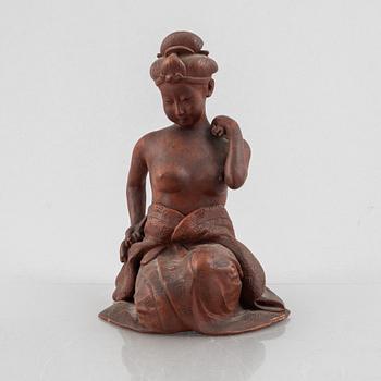 A pottery figure of a seated woman, Japan, Taisho period (1912-26), signed Sais.