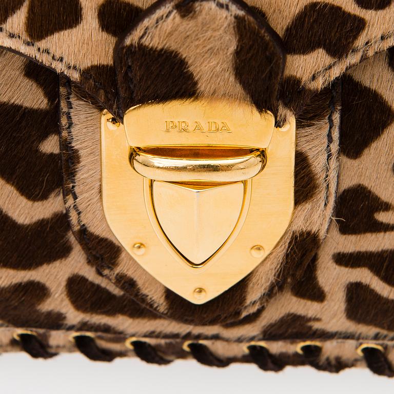 An Animal Print Pony Hair Shoulder Bag.