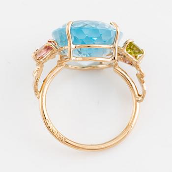 Large blue topaz, peridot, pink tourmalines and brilliant cut diamond cocktail ring.