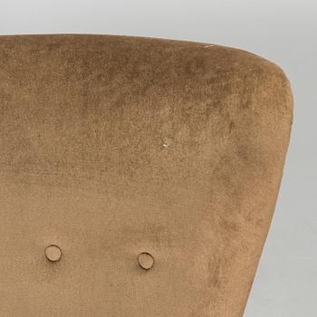 A pair of mid-20th century armchairs.