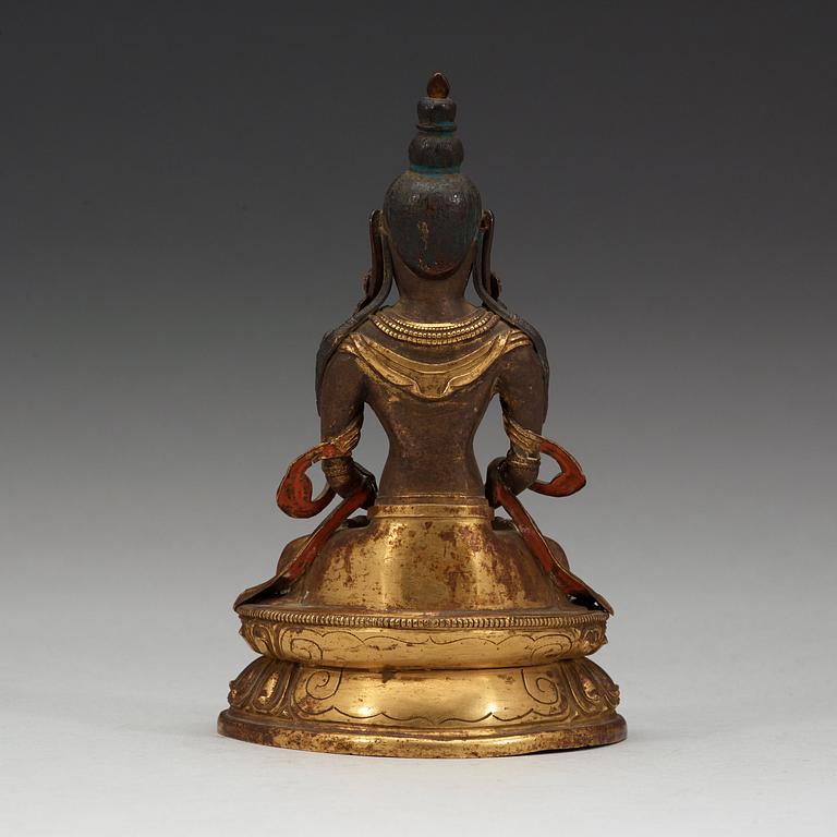 A gilt copper figure of Amitayus, Tibeto-Chinese, 18th Century.