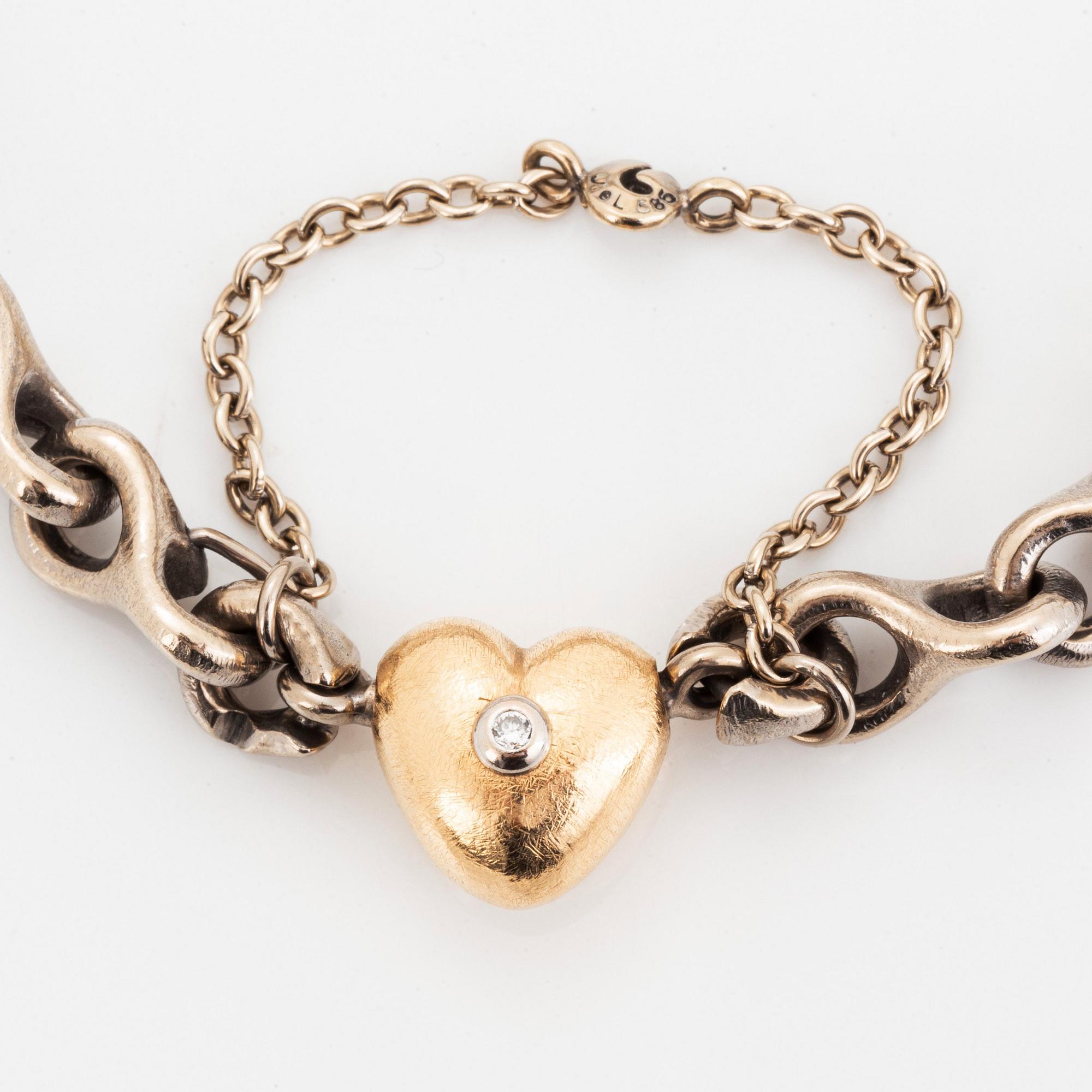 An Ole Lynggaard bracelet with a detachable clasp in 14K white gold and gold.