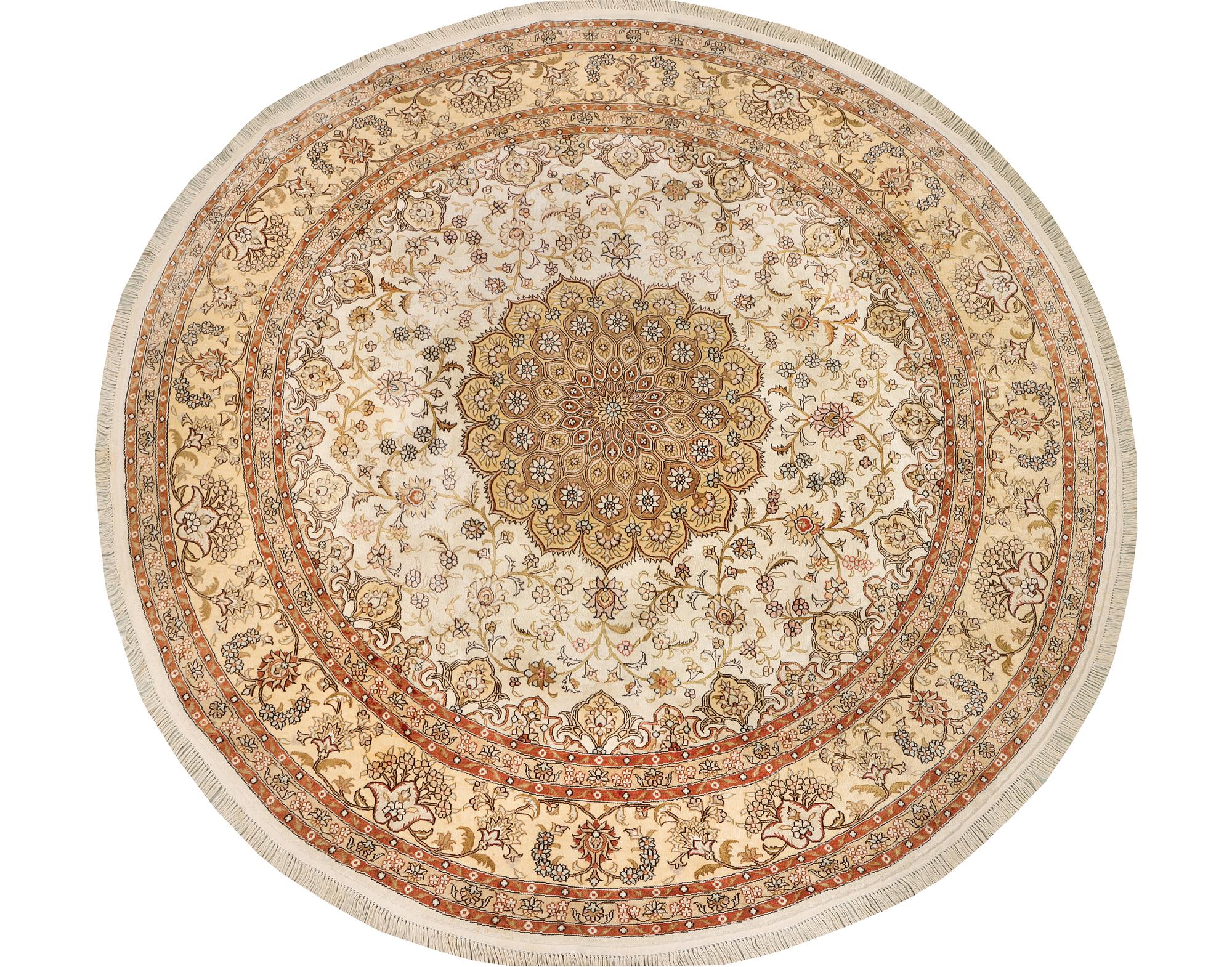 An oriental silk rug, diameter c. 216 cm.