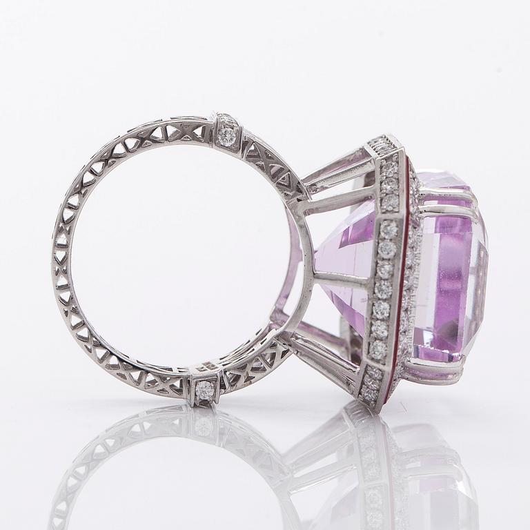 A 14K gold ring with kunzite and diamonds.