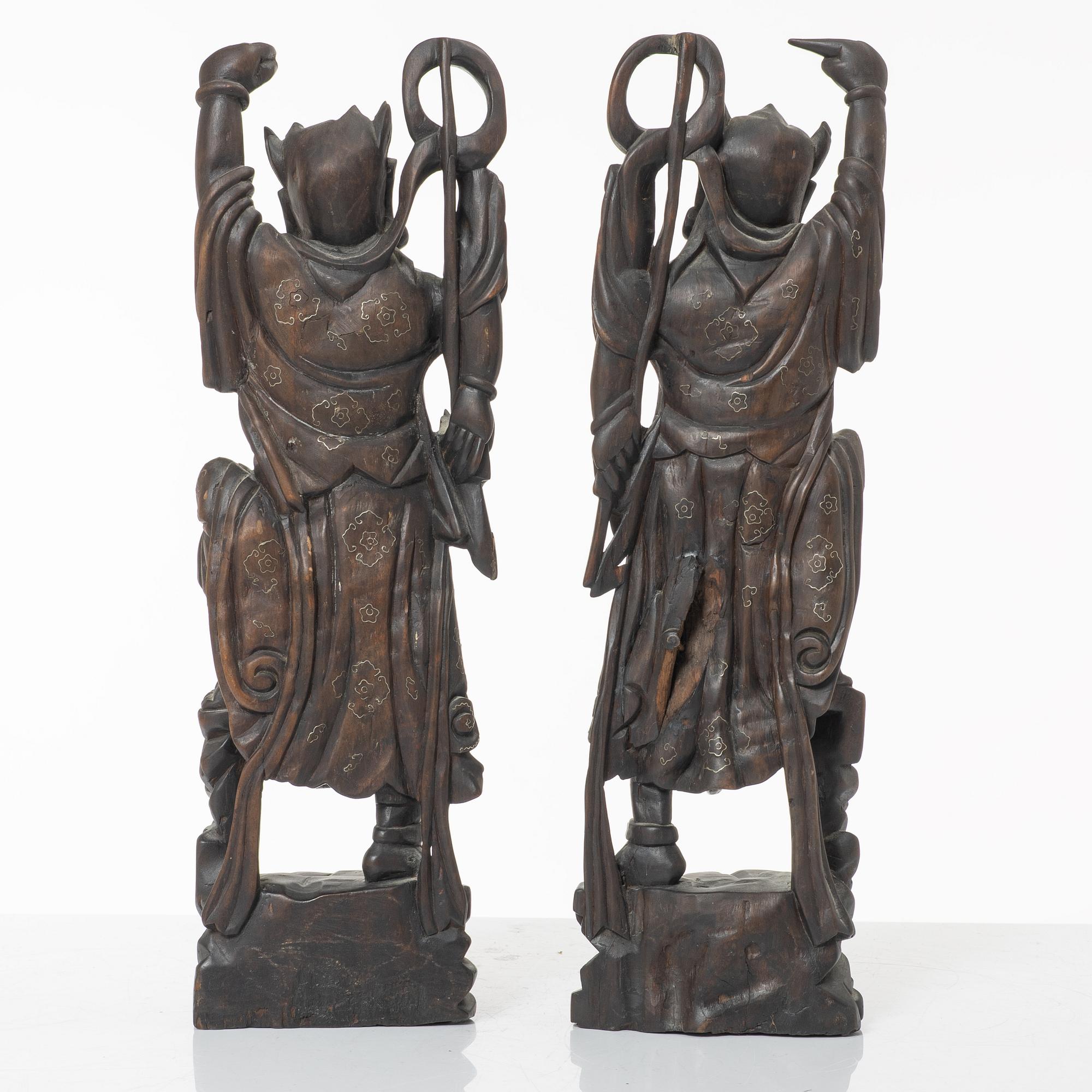 A pair of Chinese hardwood figures, 20th century.