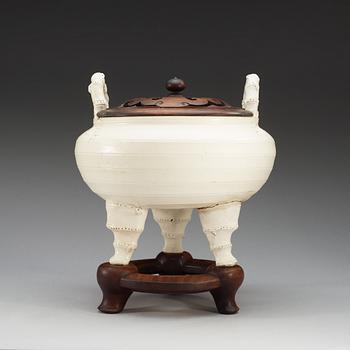 A large white glazed ceramic tripod censer, Qing dynasty, 19th Century, with Chenghua six character mark.