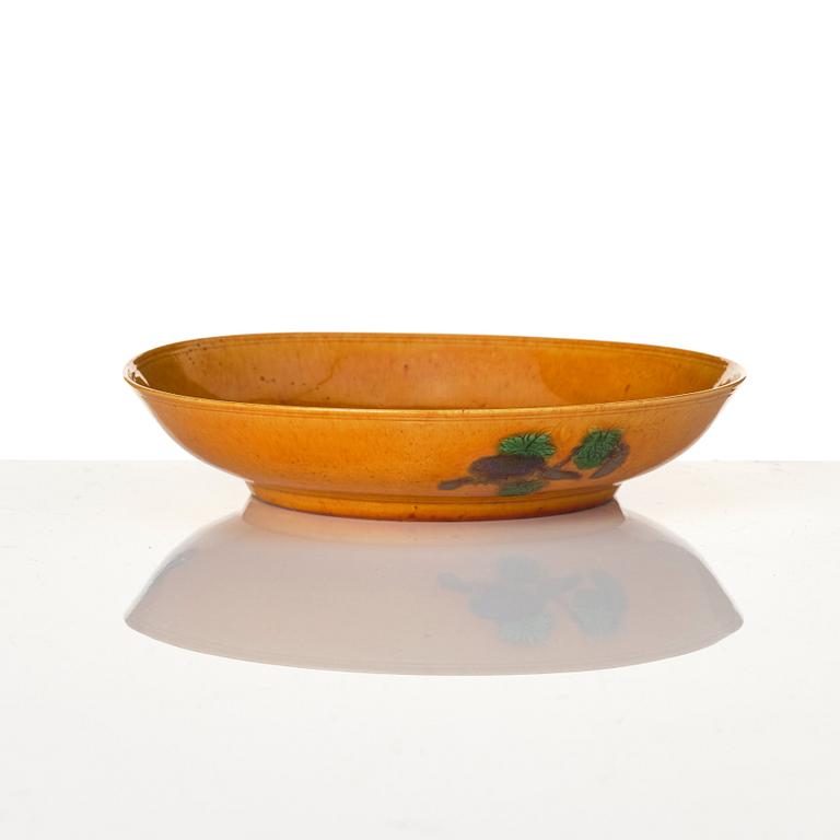 A yellow glazed dish, Qing dynasty, circa 1700.