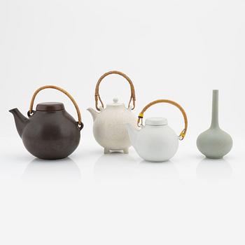 Gunnar Nylund, a stoneware teapot from Rörstrand and two teapots and a vase, Arabia.