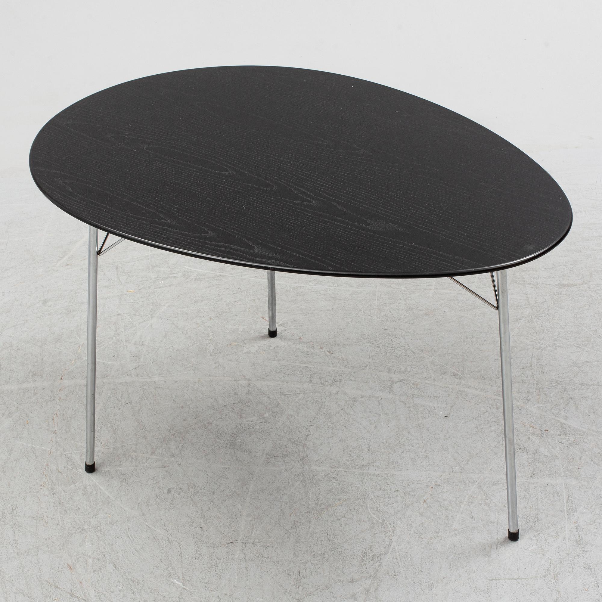 An Arne Jacobsen "Centenary Package" comprising three "Ant Chairs" and an eggshaped table, Fritz Hansen, Denmark.