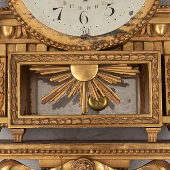 A Gustavian wall clock, late 18th century.